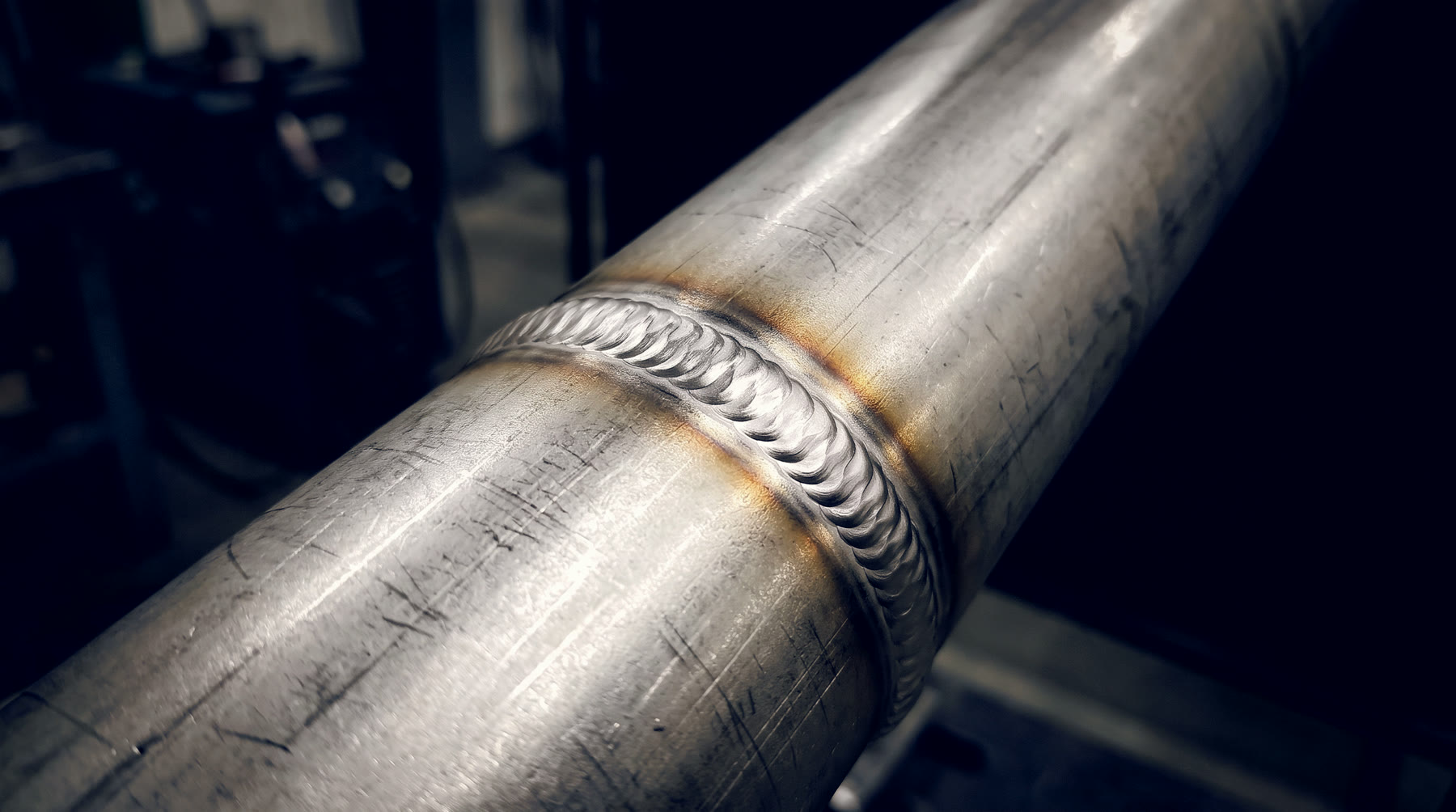 A welded pipe joint, bead wrapped around the tube