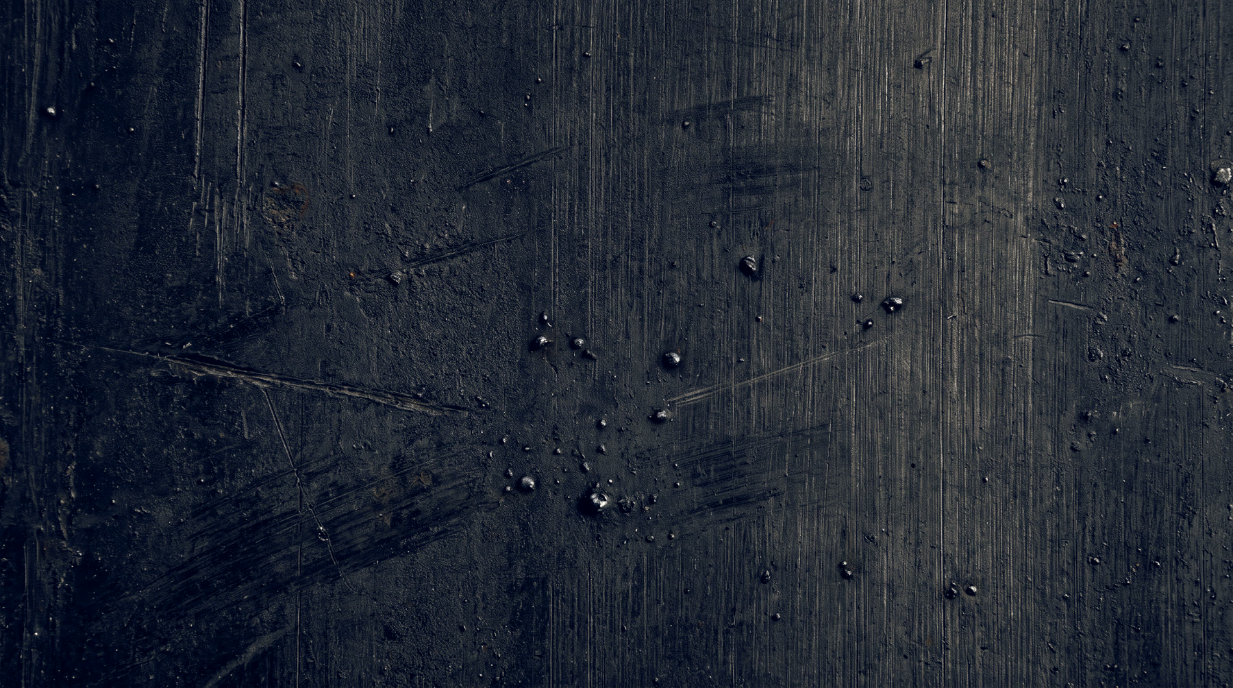 A worn steel work surface on the shop floor